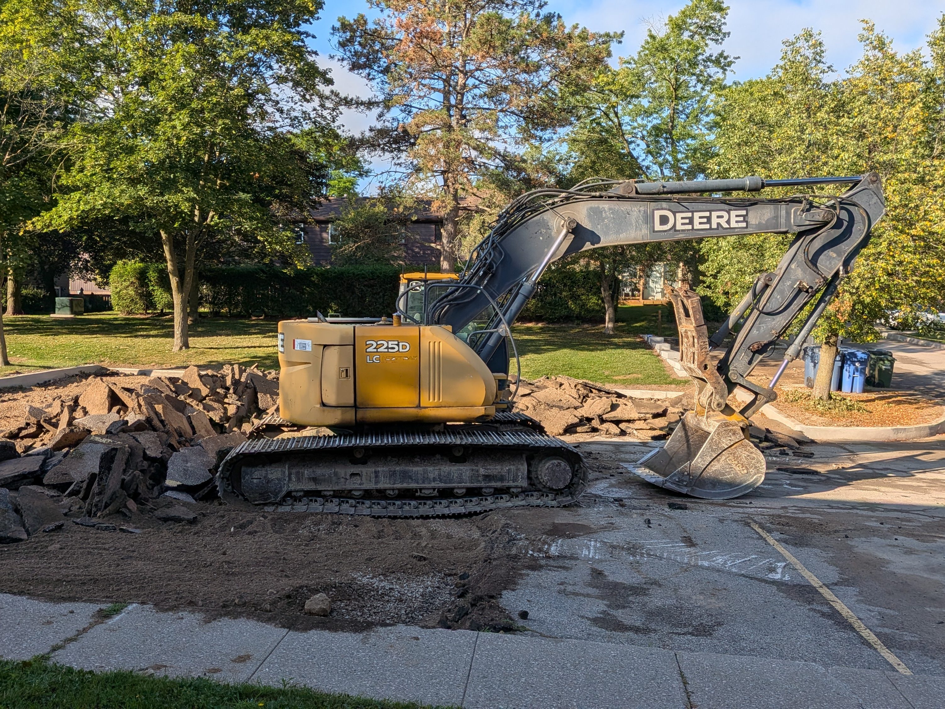 Picture of the excavator tearing up my parking spot